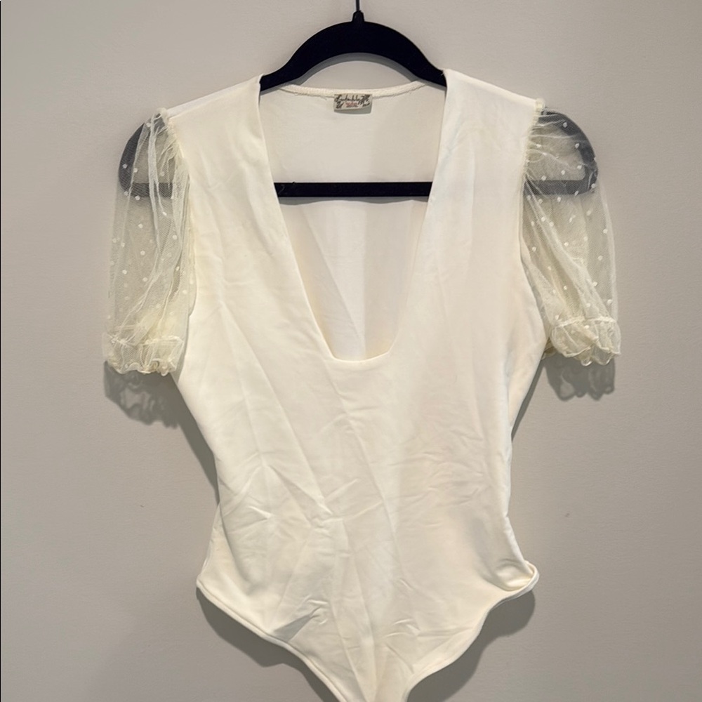 Free People white plunge neck bodysuit with polka dot sleeves